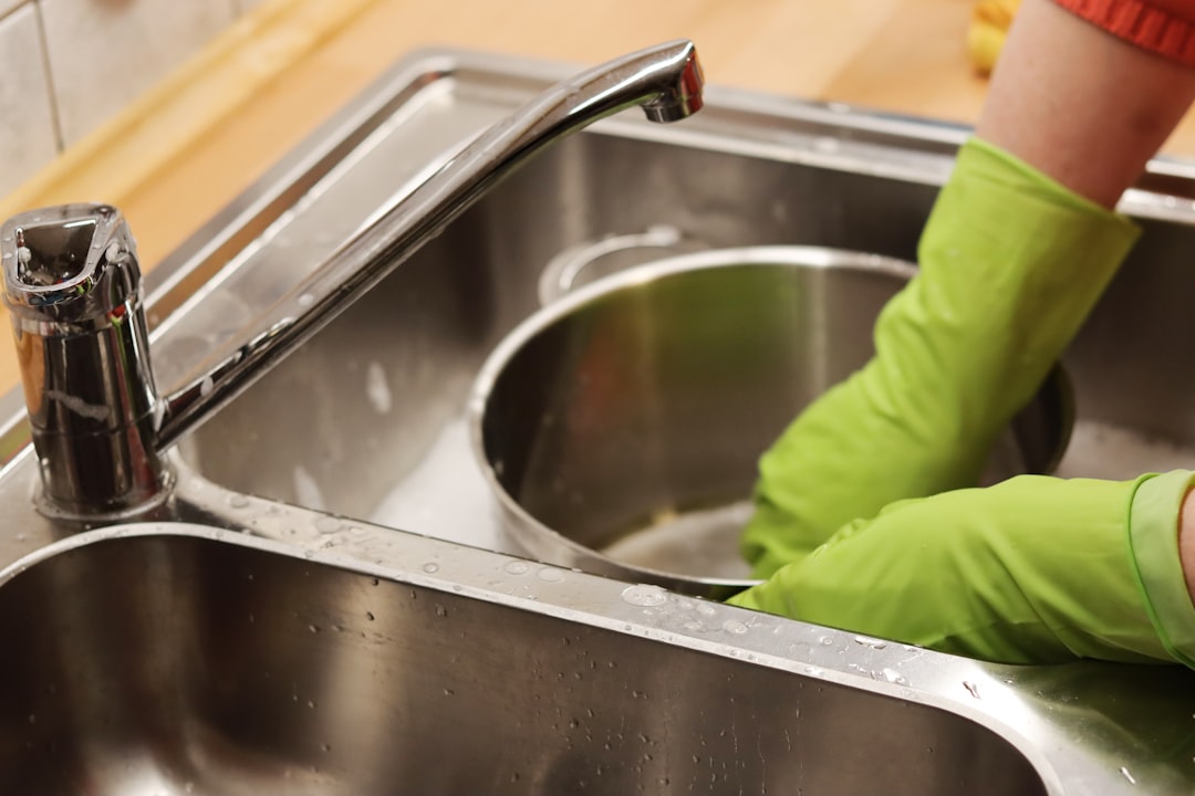 Kitchen sink drain being maintained in a Victoria BC home